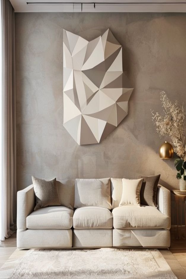 A contemporary living space with a neutral-toned sofa The wall above features a large stylish geometric wall decal in a